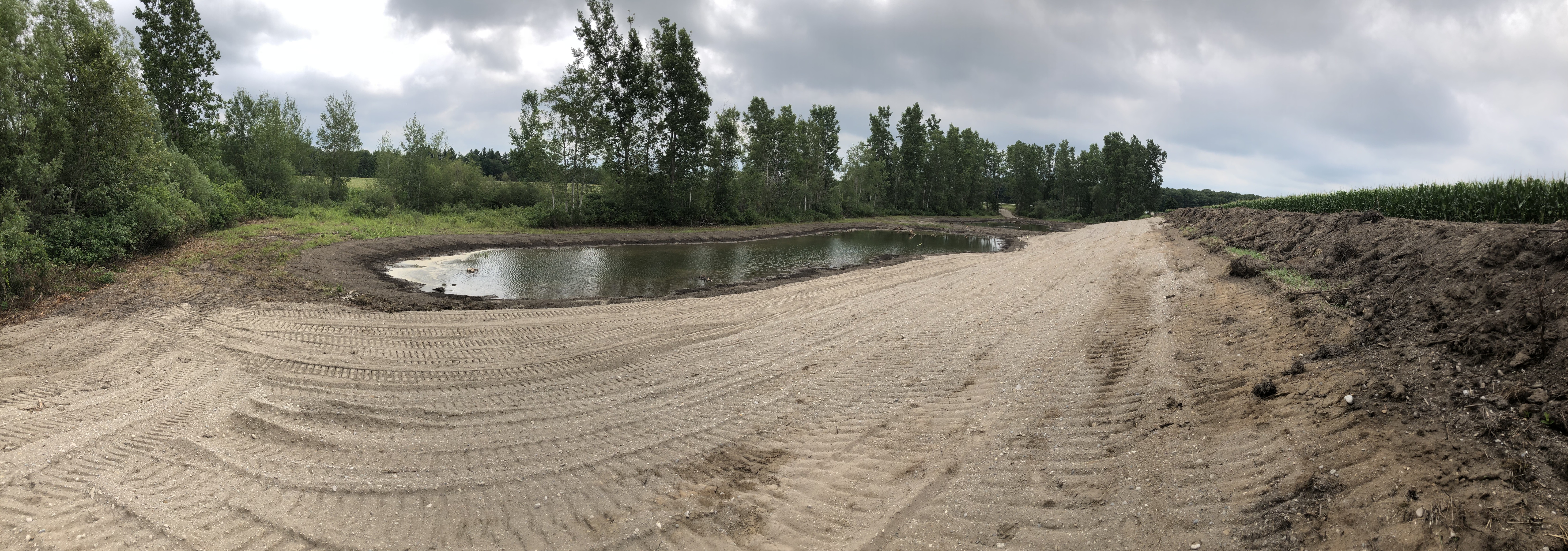 Construction of wetland in progress. Topsoil has been removed and kept aside while final grade is complete.